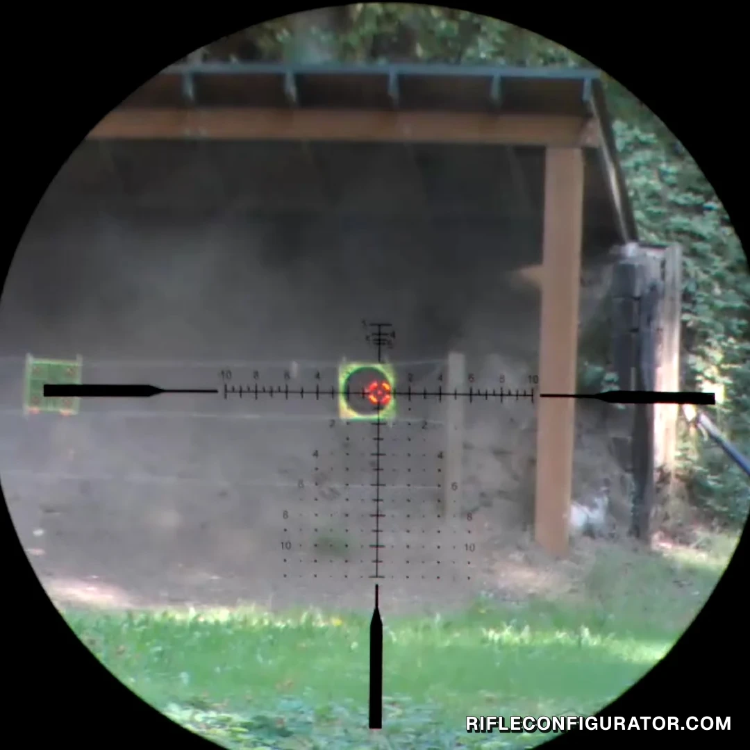 App live view through the Vector Optics Continental at high power, the hold grid and illuminated center on a round target in front of the berm