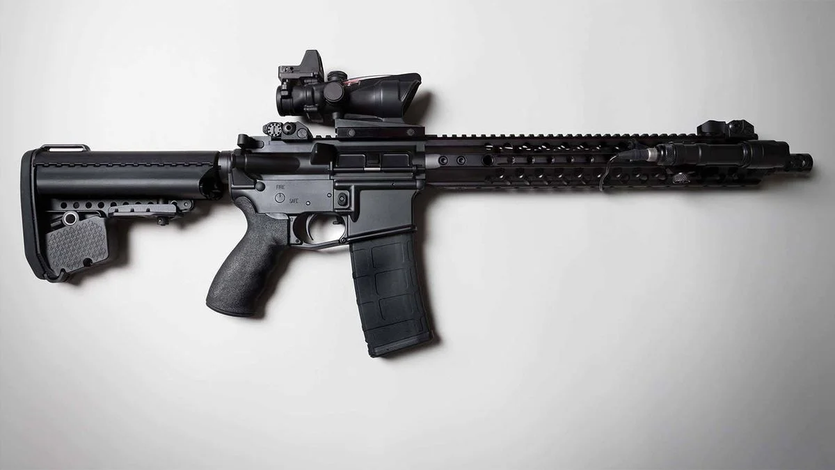 A modern AR-15 semi-automatic rifle lying on a light surface, the type of firearm at the center of Viramontes v. Cook County.