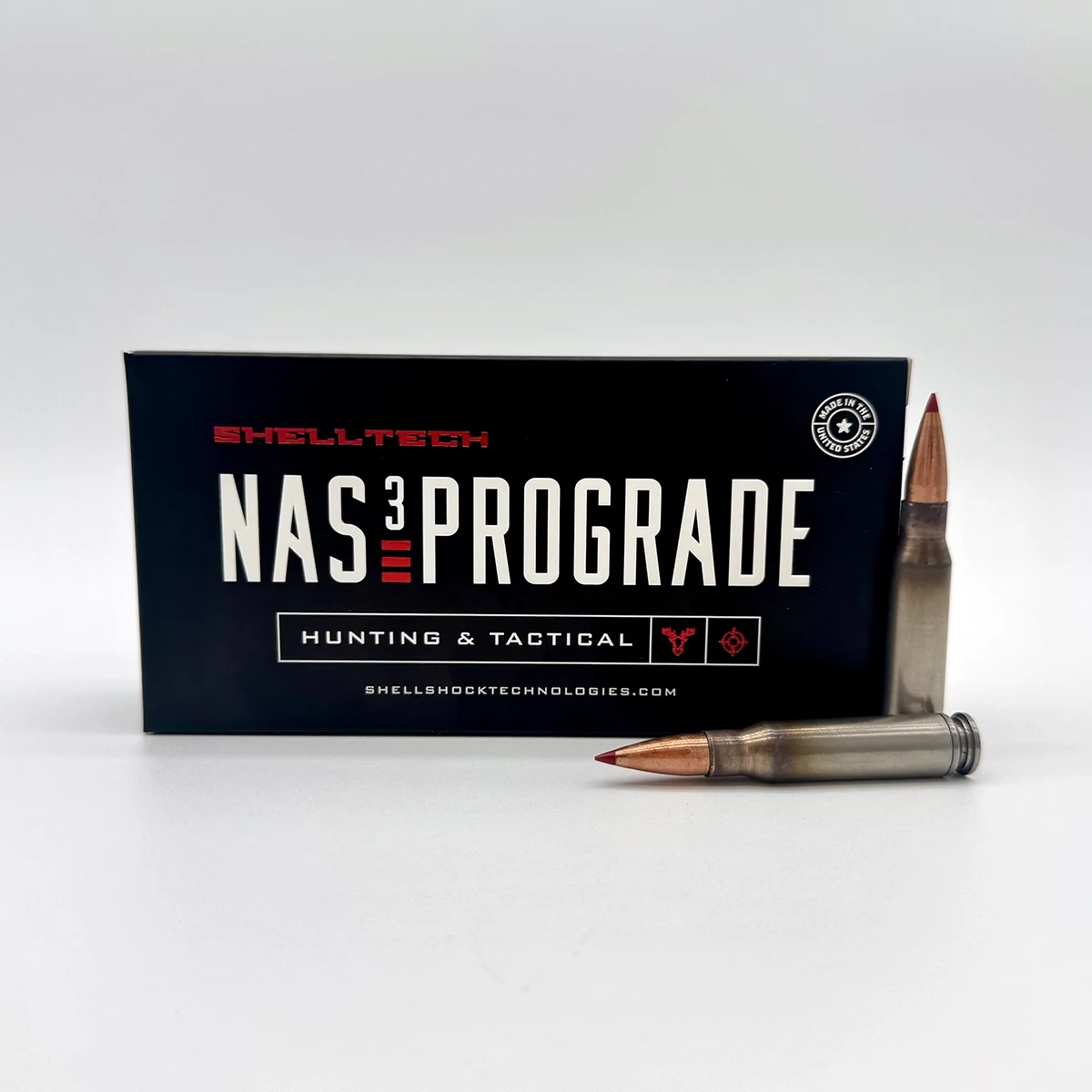 Shell Tech 308 NAS3 PROGRADE ammunition box with two loaded .308 cartridges showing the nickel-alloy case body
