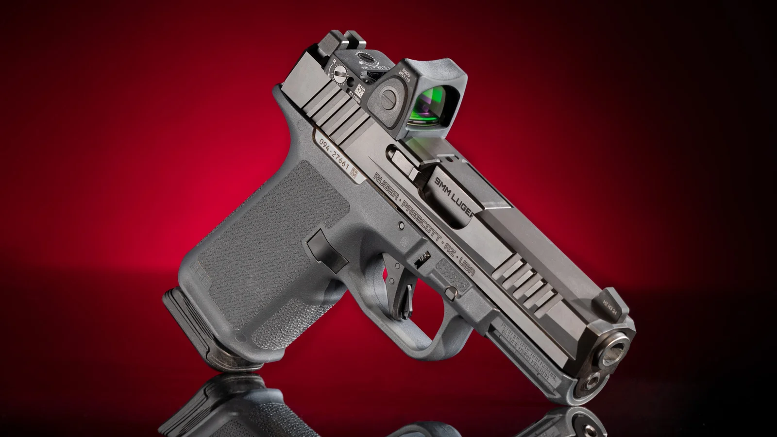 Factory Ruger RXM 9mm pistol with red dot mounted, the host firearm for the Strike Industries SMC Bravo chassis