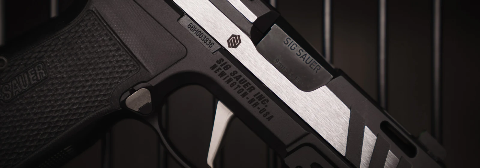 Close-up of the SIG P365-AXG Equinox showing the Custom Works slide mark, 9mm barrel, E-nickel trigger, and black G10 grip panel