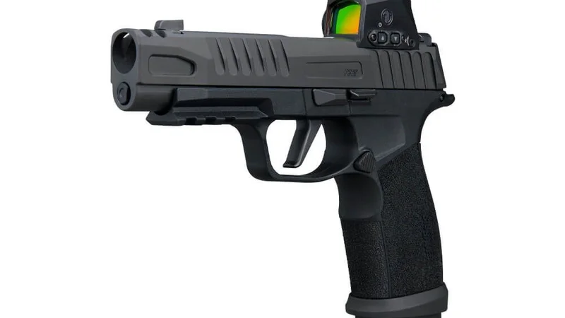 SIG Sauer P365-FUSE COMP from the left front showing the slide-integrated expansion chamber, compensator ports, and aggressive FUSE serrations