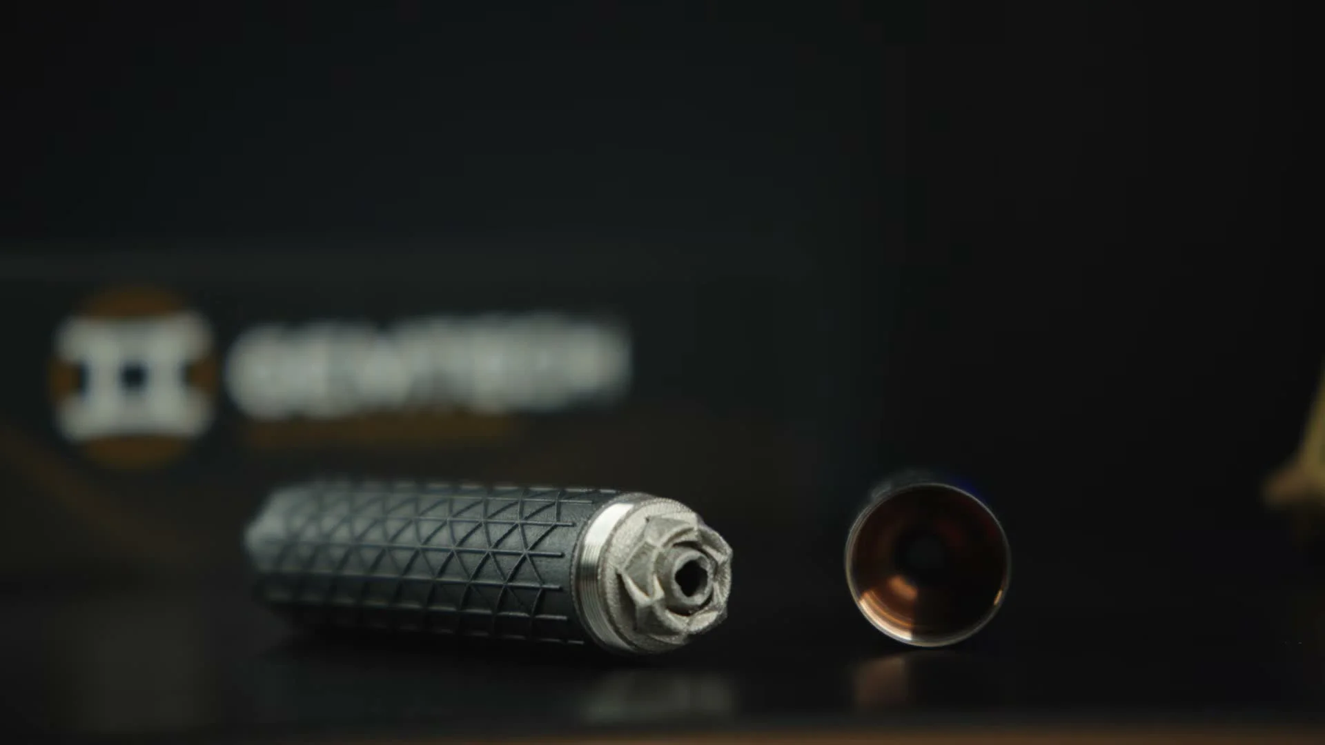 Gemtech Nebula 5.7 disassembled showing 3D-printed titanium baffle stack