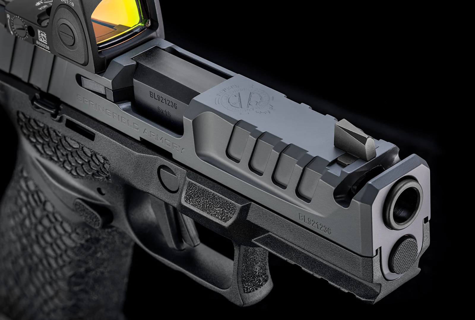 Close-up of the Echelon Pro Comp Springfield Grey Cerakote slide with forward serrations, front sight, and a slide-mounted red dot