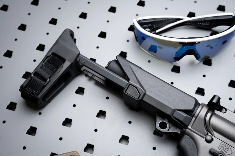 Close-up of the SB Tactical HBPDW collapsible brace on the Springfield SAINT Victor 9mm PDW, showing the three-position lock mechanism