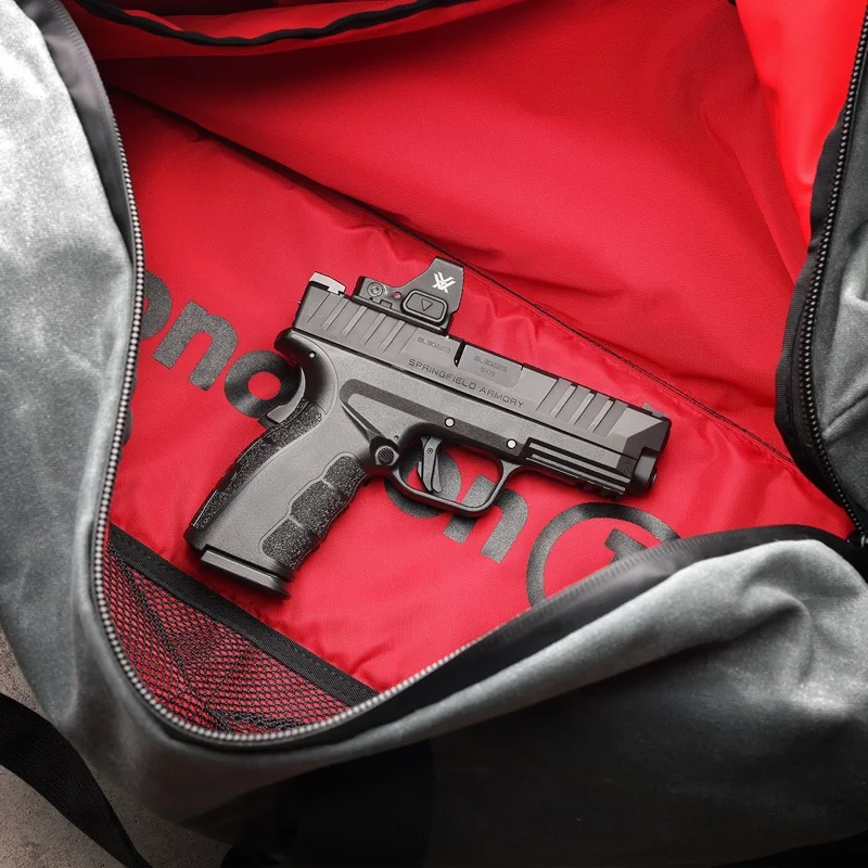 Springfield XD Mod.4 OSP with red dot optic in a Springfield Armory range bag