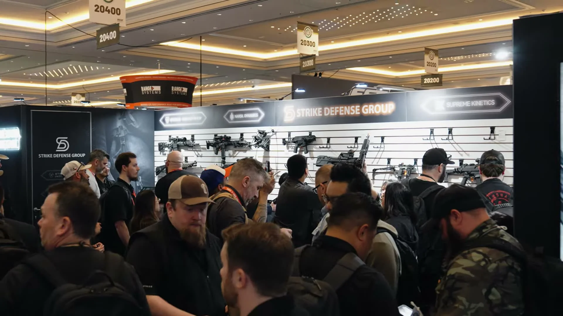 Strike Defense Group booth at SHOT Show 2026 showing product display wall with all brand divisions