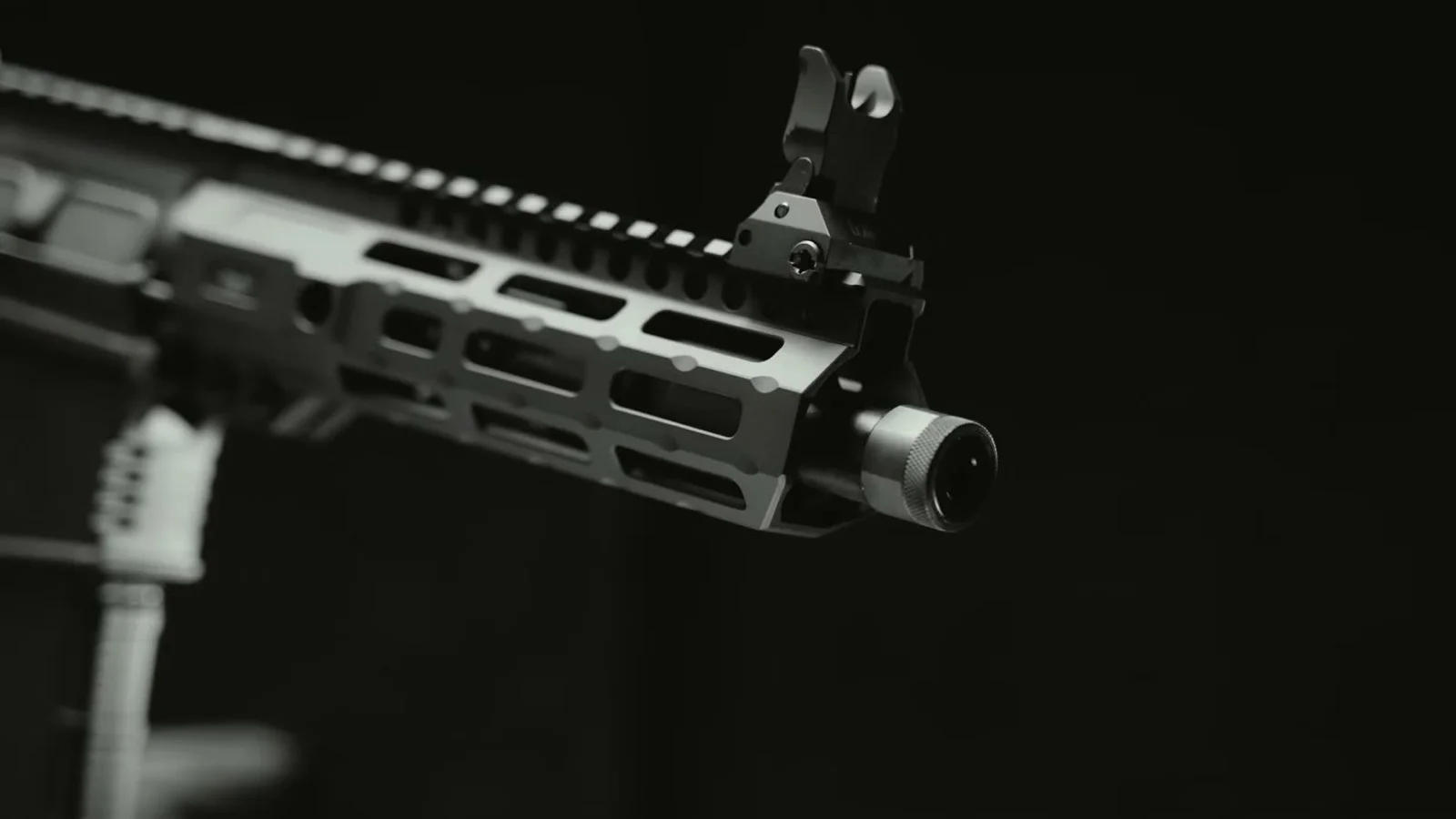 Close-up of the threaded muzzle with thread protector installed and the folding front sight on the M&P15 AXE .300 Blackout