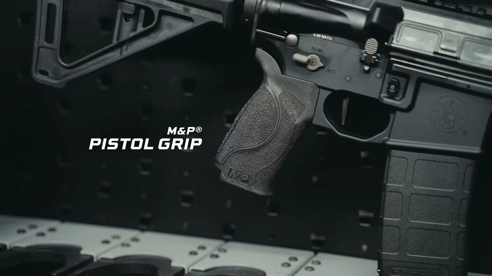 Smith & Wesson M&P15 AXE Pistol lower receiver showing the M&P pistol grip, ambidextrous selector marked 5.56 NATO, and S&W logo
