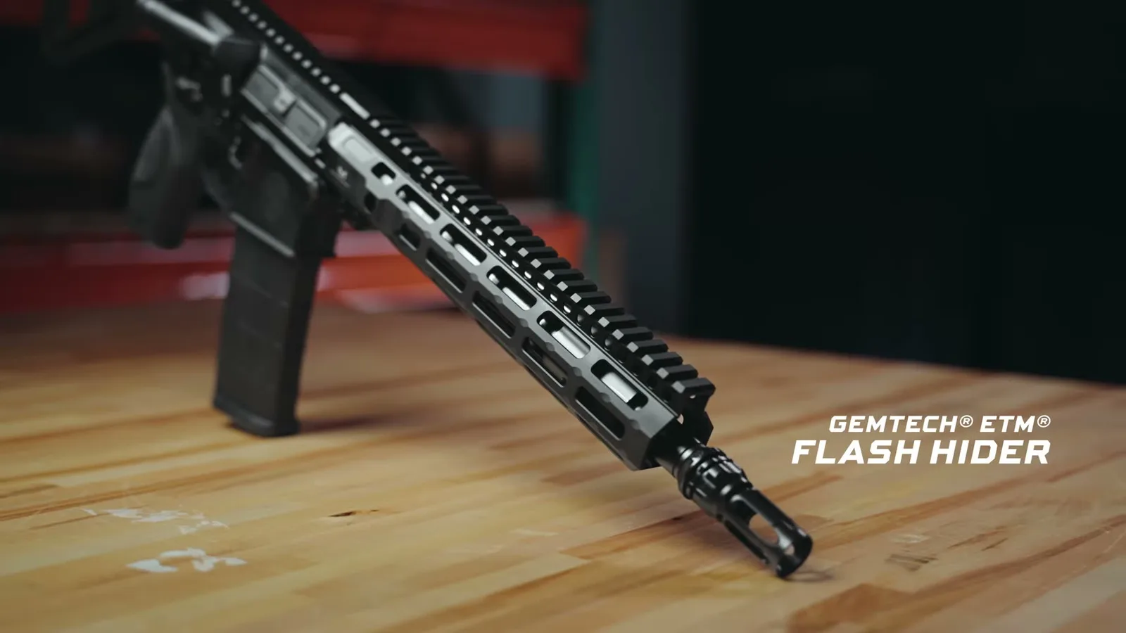 Gemtech ETM flash hider on the threaded muzzle of the M&P15 AXE Pistol with the Midwest Industries M-LOK handguard
