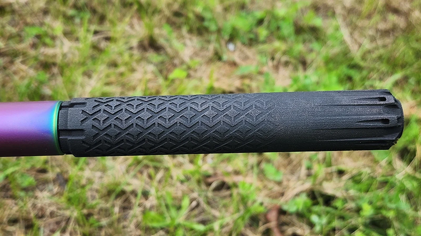 Close-up of the Taurus TTX22 sintered titanium texture and fluted muzzle on a 10/22 barrel