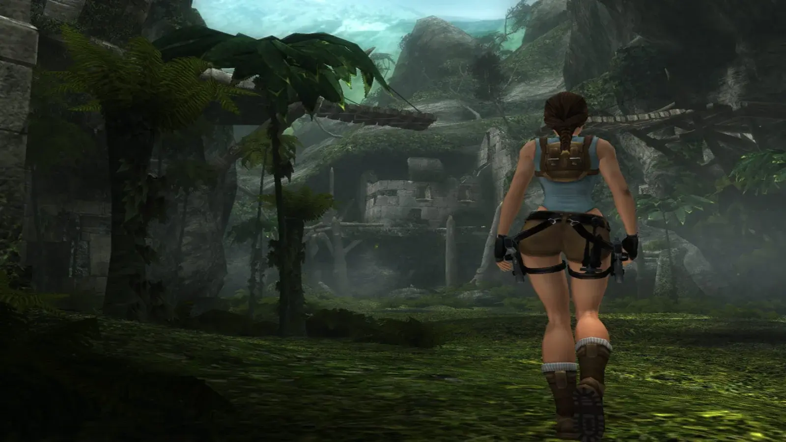 Lara Croft exploring jungle ruins in Tomb Raider Anniversary with dual pistol holsters visible