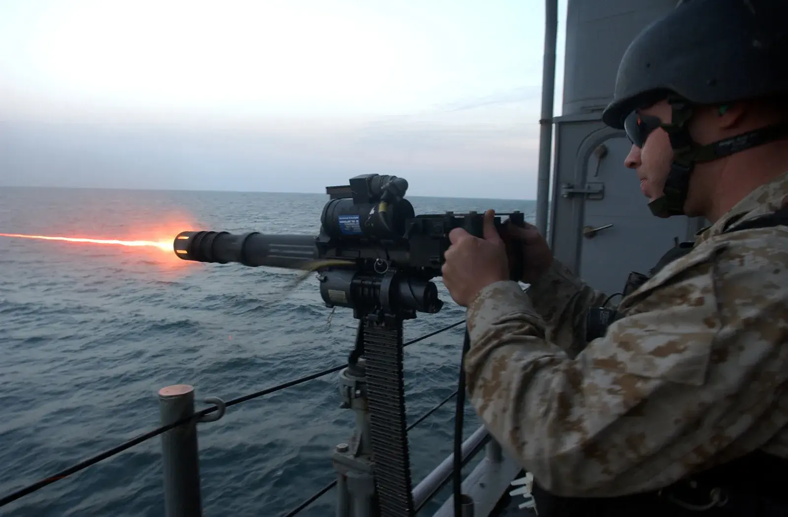 U.S. service member firing a mounted GAU-17 Minigun