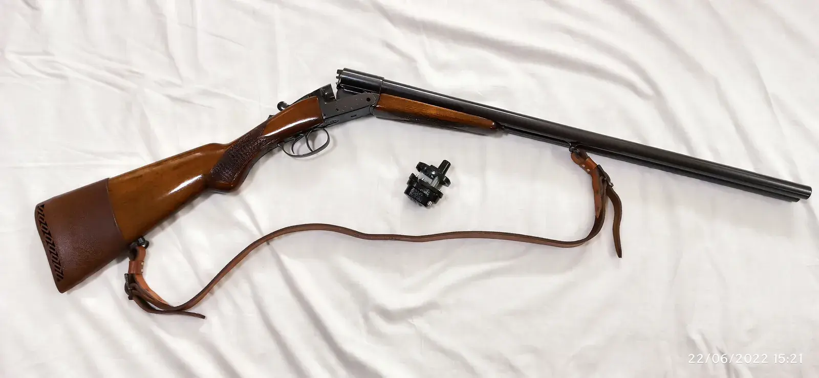 Real side-by-side break-action shotgun, representative rather than an exact model match