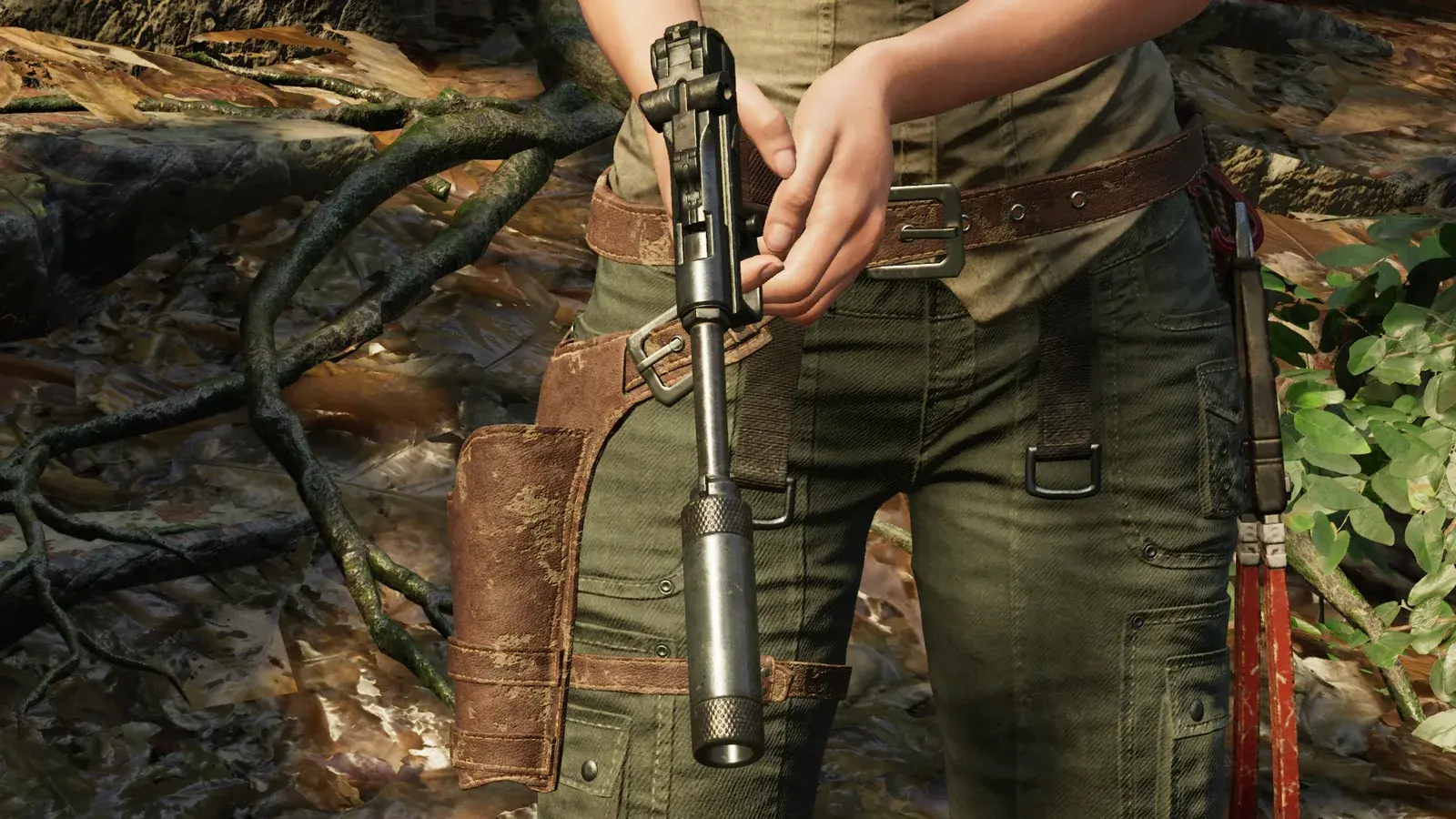Lara holding the suppressed Silent Sting pistol in Shadow of the Tomb Raider