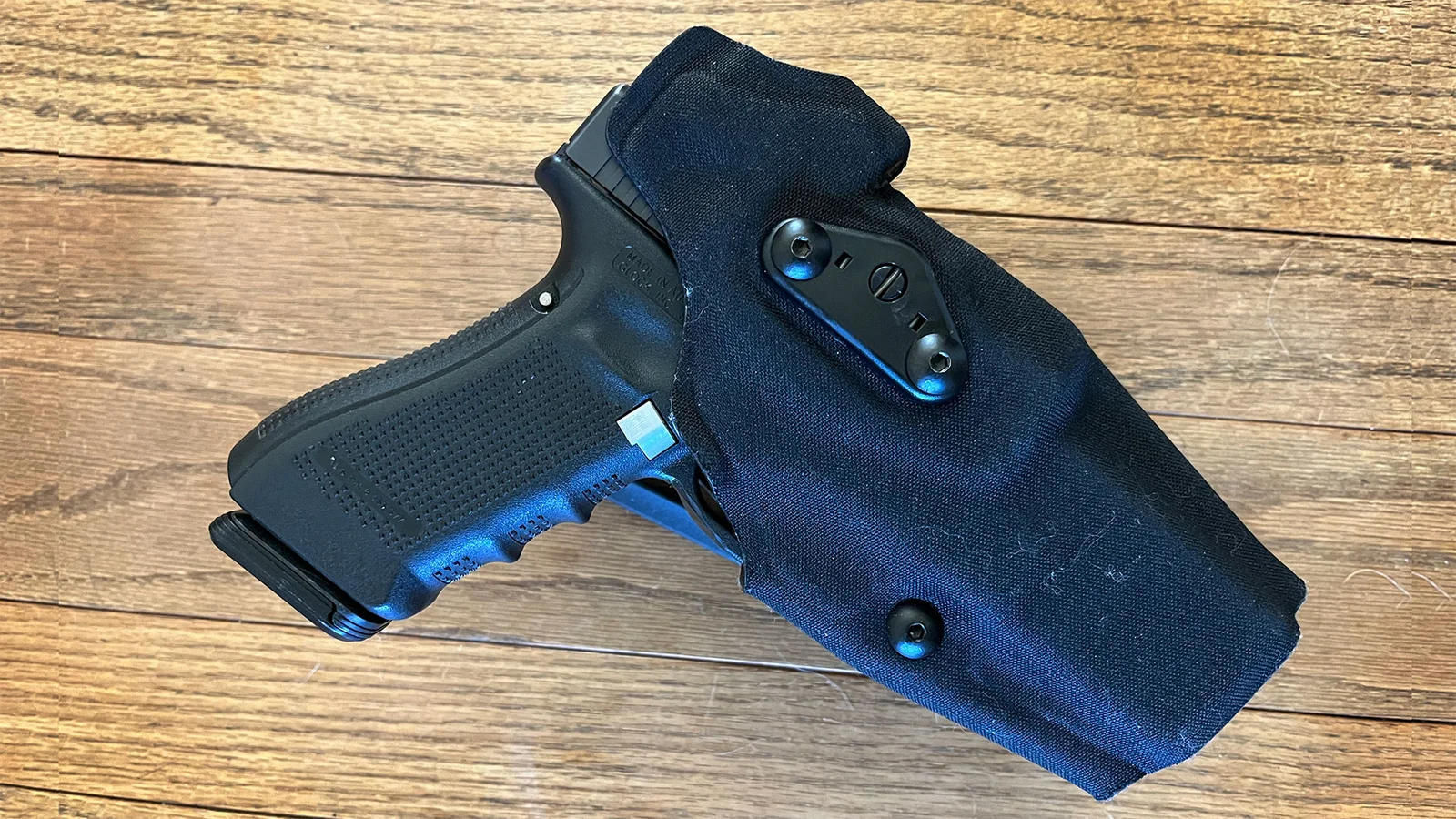 Safariland ALS duty holster with a Glock pistol inserted, showing the single active lock and hood