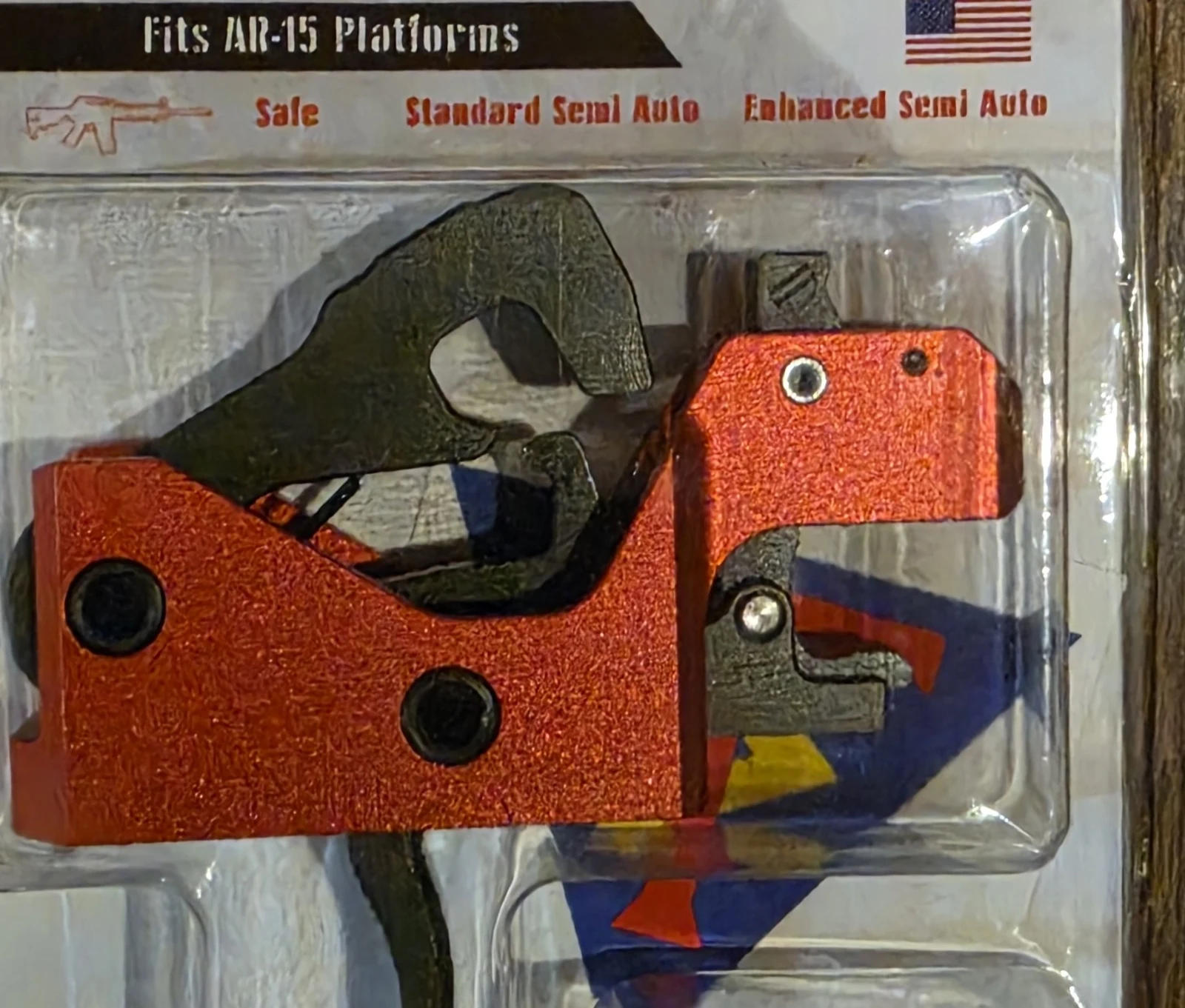 The Triggered Company LAT red trigger cassette in its blister packaging showing the Safe, Standard Semi Auto, and Enhanced Semi Auto selector positions