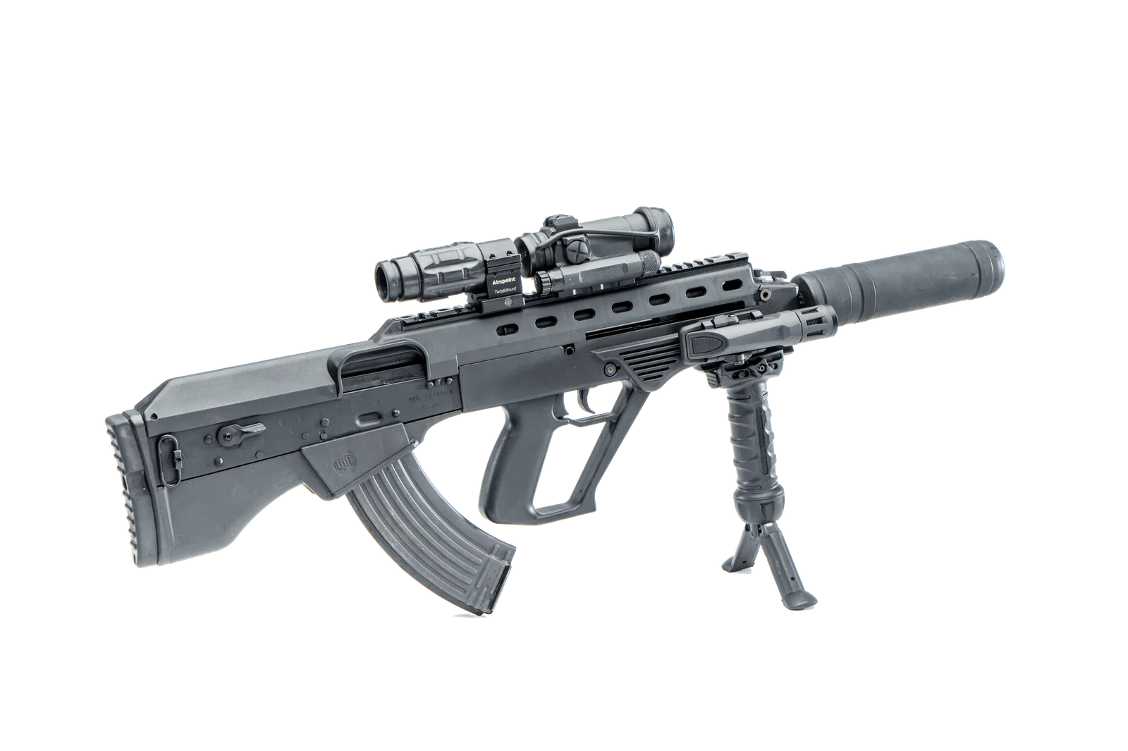 A Ukrainian Malyuk Vulcan bullpup rifle in 7.62x39mm fitted with a red dot sight, magnifier, vertical foregrip with integral bipod, and a suppressor