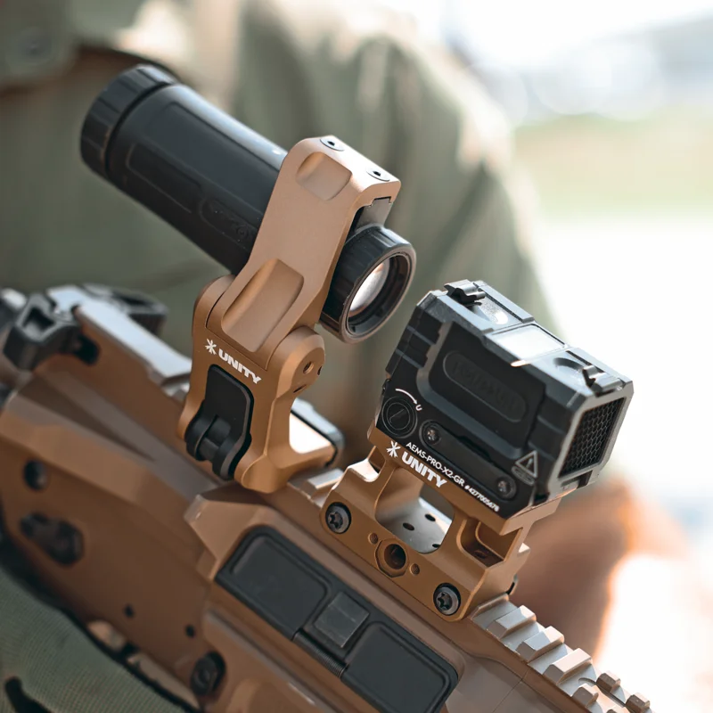 Unity Tactical FAST FTC Holosun magnifier mount in the raised position on an FDE AR-15 with a Holosun red dot, showing the clean alignment between the HM3X and the primary optic.