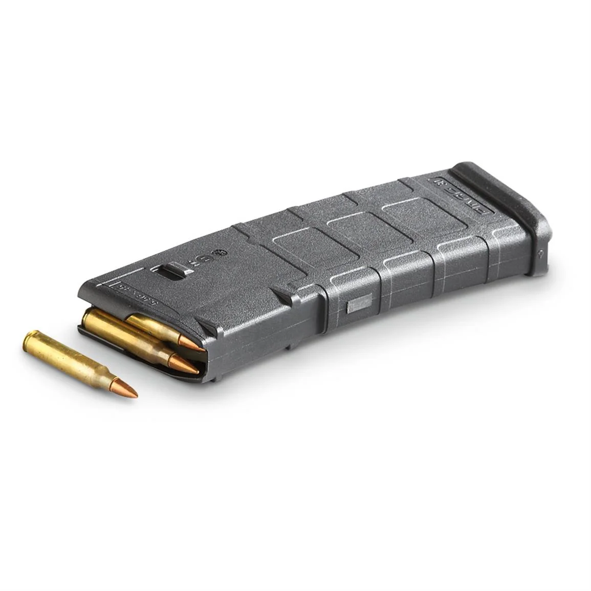 A black Magpul PMAG 30-round 5.56 magazine with loose rifle cartridges beside it