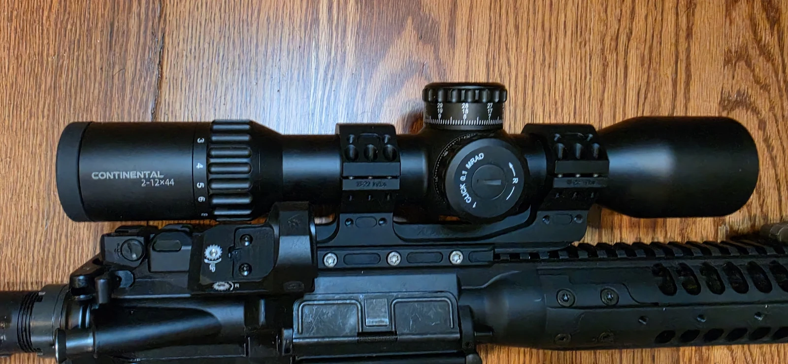 The Vector Optics Continental 2-12x44 seen from above along its full length, showing the CONTINENTAL 2-12x44 engraving, magnification numerals, elevation turret and the windage turret marked 1 CLICK 0.1 MRAD