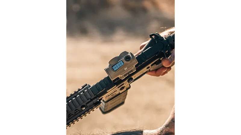 Vortex Crossfire II Solar red dot in tan mounted on an FDE AR-15 in the field