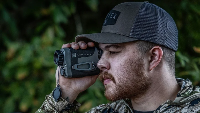 Vortex Veil 400 thermal monocular shown in a field environment