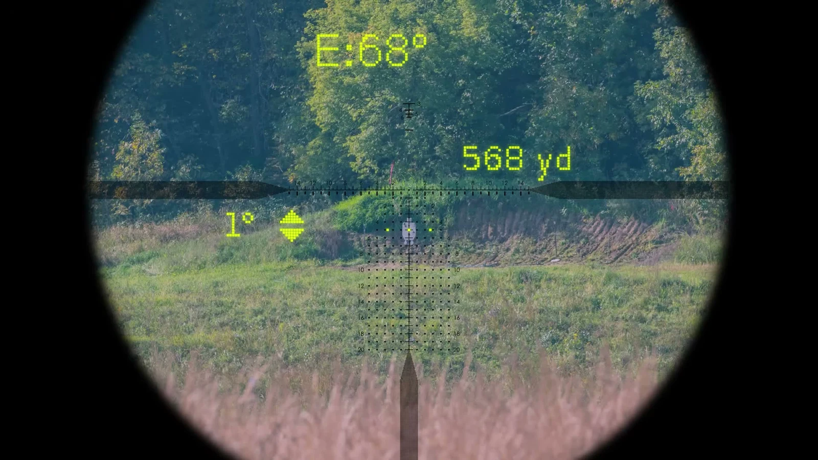 View through the Vortex XM157 showing the etched reticle, a 568 yard range readout, a 68 degree elevation reading, a 1 degree cant indicator, and a projected aiming dot on a steel target