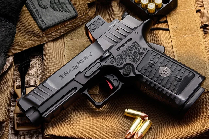 Wilson Combat BULWARK pistol resting on tactical gear with 9mm ammunition