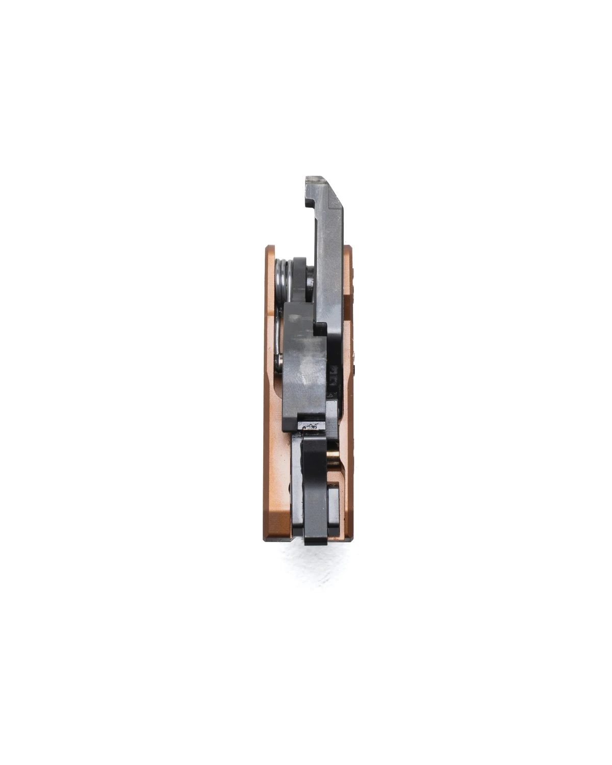 Rear edge-on view of The Wrangeler AK trigger cassette showing the stacked fire-control parts and spring