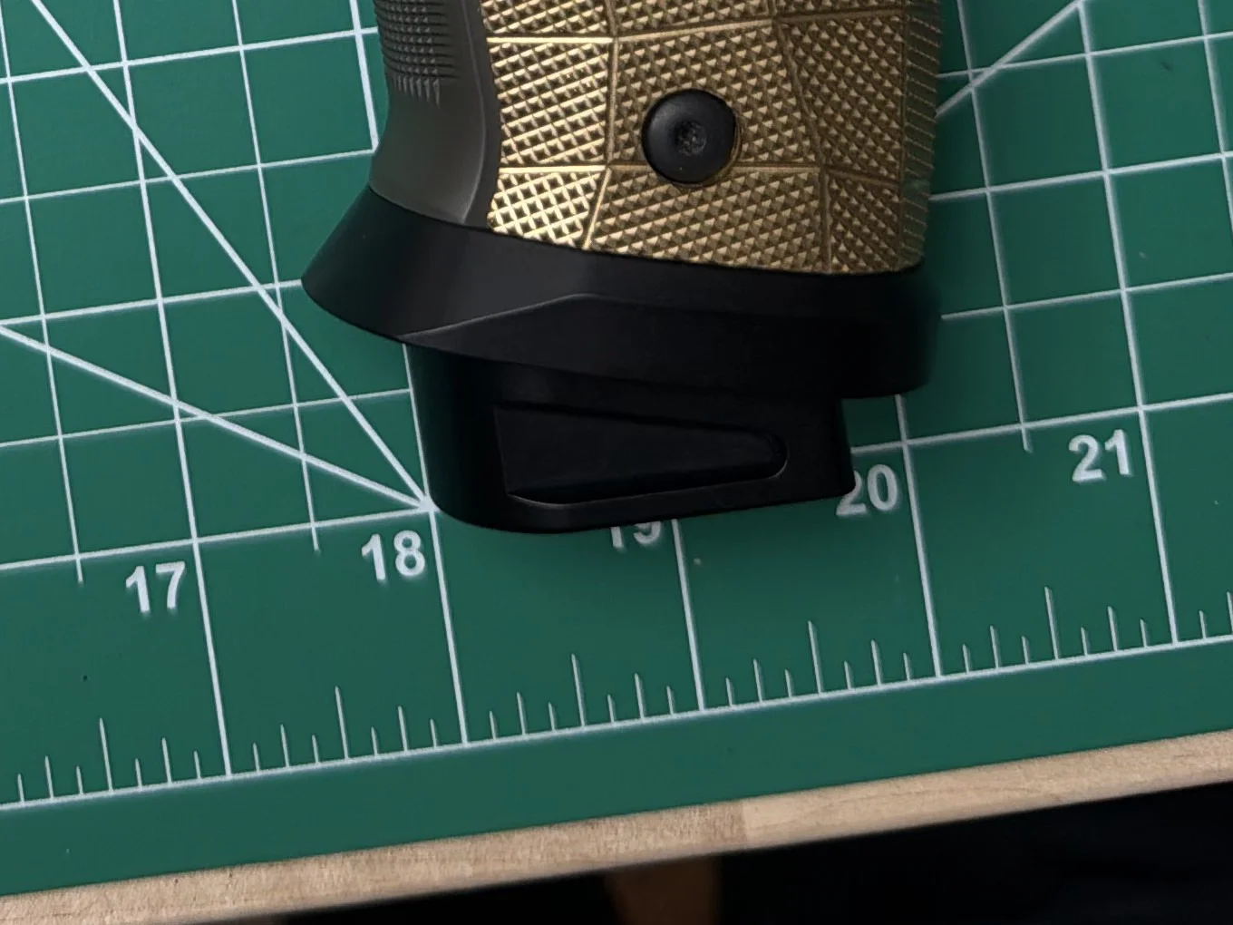 Black Cascade Range Systems P226X Comp Magwell on a friend's P226 XFive Legion, with a Comp Basepad seated in it and the lower edge of a LOK brass grip panel above