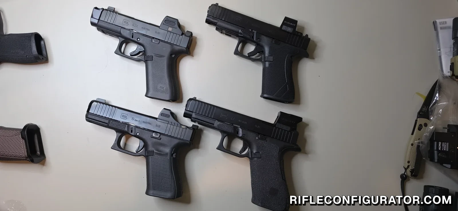 Four optic-equipped Glock pistols on a white bench, a 43X and a 48 on the top row and a 19 Gen5 and a full-size 47 on the bottom row, each with a red dot mounted