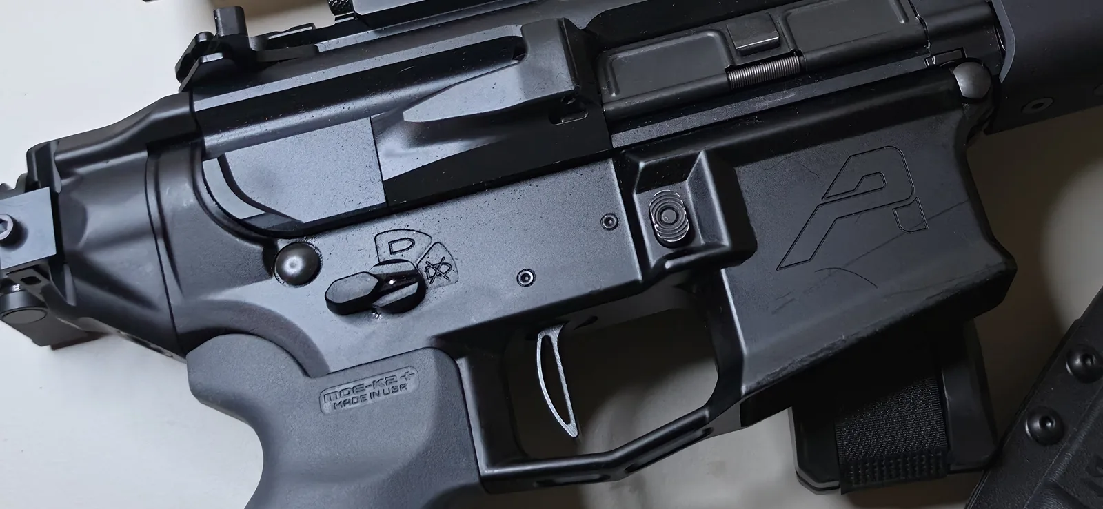 SIG MCX Rattler LT upper mated to an Aero Precision lower receiver, showing the flat-face trigger, safety selector, and Magpul MOE-K2 Plus grip