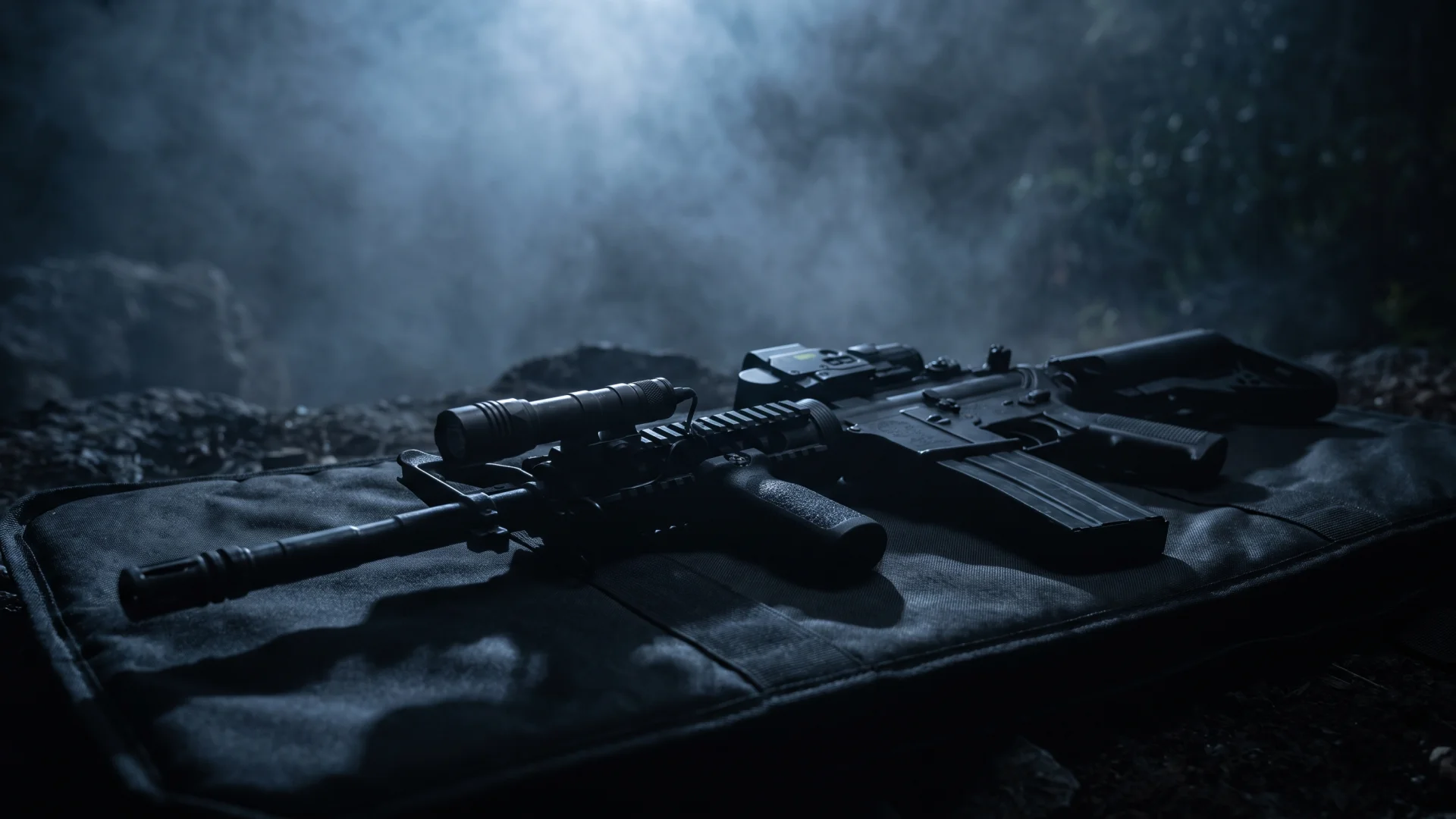 AR-15 with weapon light and IR laser on a rifle case under moonlight and fog